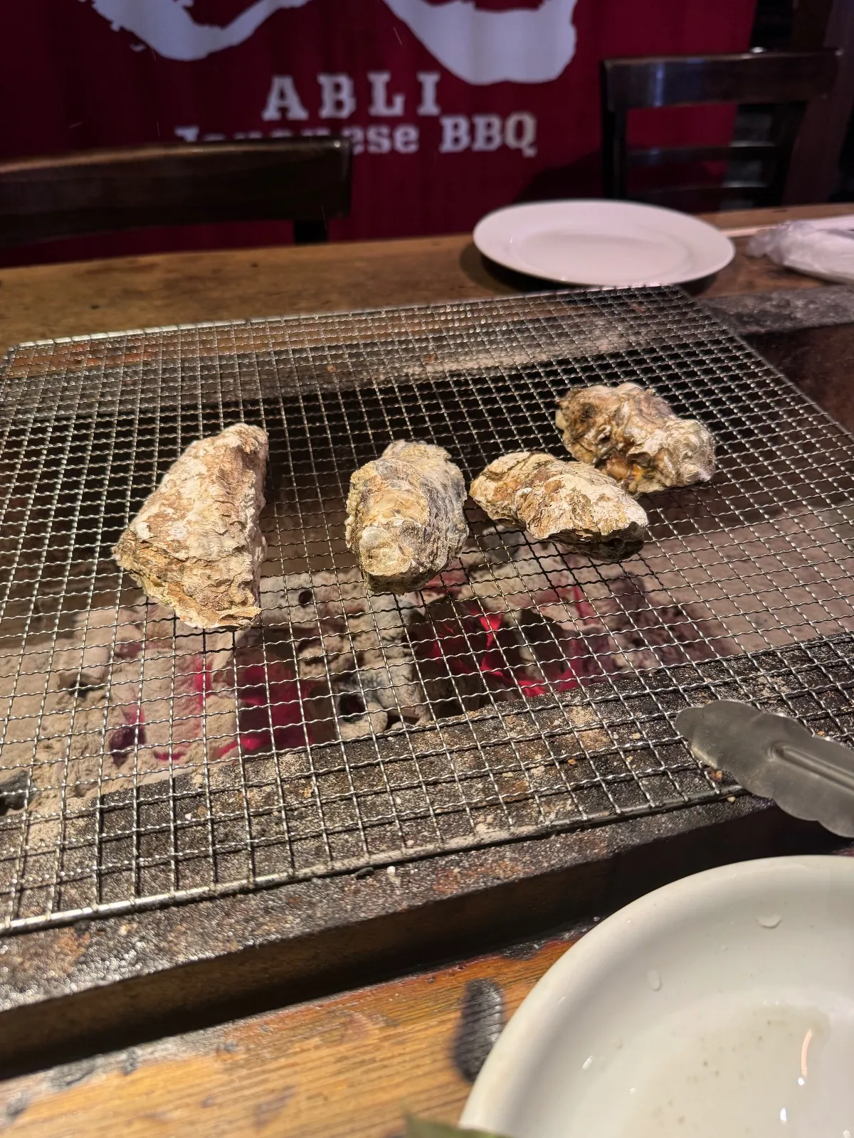 Hot coals at the tables…it’s getting sweaty in here!