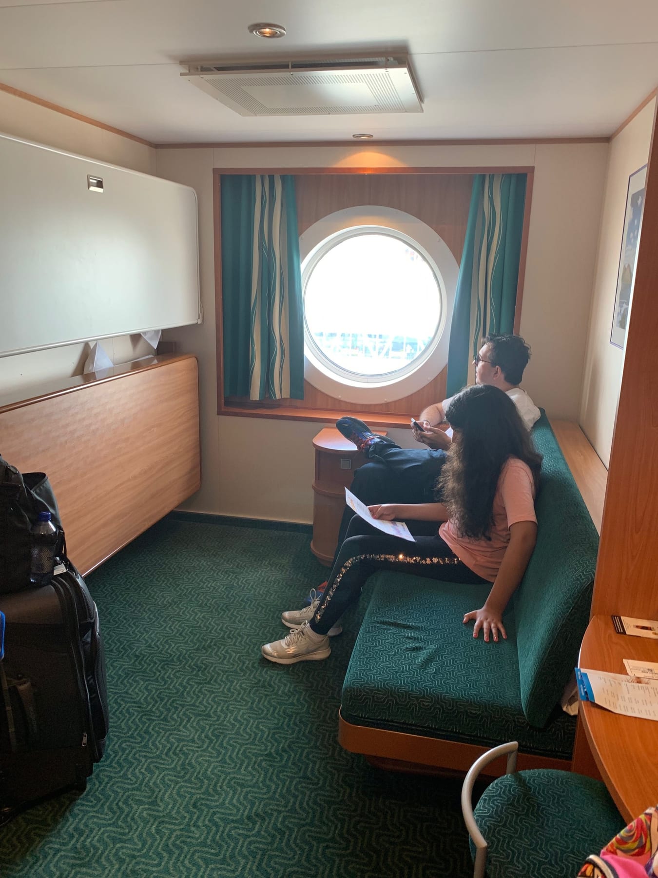 Our cabin...with a window, thank goodness. You can see two beds folded up against the wall on the right, and the couch m