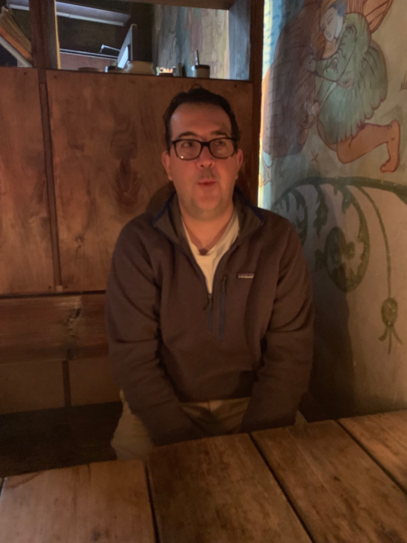 The restaurant is lit by candlelight and there are medieval murals on the walls. The staff, of course, are dressed accor